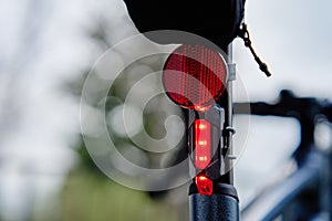 Glowing bicycle taillight. Rear led light on bike