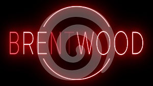 Glowing and blinking red retro neon sign for BRENTWOOD