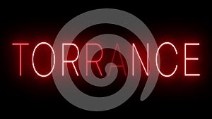 Glowing and blinking red retro neon sign for TORRANCE