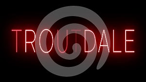 Glowing and blinking red retro neon sign for TROUTDALE