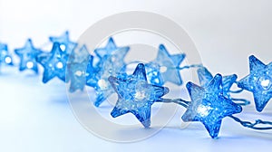Glowing Blue Star String Lights on White Background