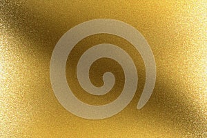 Glowing brushed golden metal wall, abstract texture background