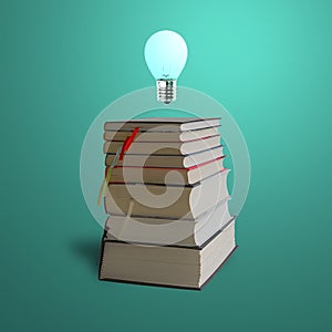 Glowing bulb on top of stack books, green background