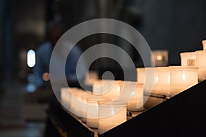 Glowing candels inside the Trento Cathetral