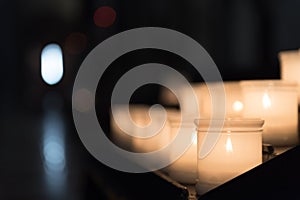 Glowing candels inside the Trento Cathetral