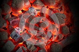 Glowing Charcoal Briquettes Background Texture photo