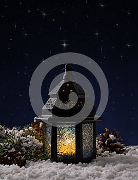 Glowing Christmas Lantern Under Winter Night Sky