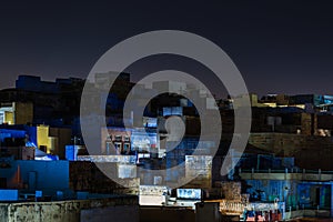 Glowing cityscape at Jodhpur by night. The majestic blue city perched on top. Scenic travel destination and famous tourist attract