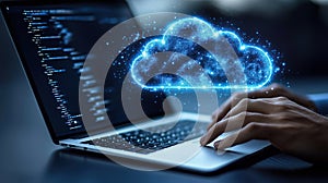 Glowing cloud computing icon above laptop keyboard programmer coding