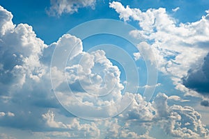 Glowing clouds on a background of blue sky. White fluffy luminous cloud