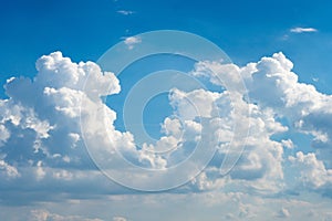 Glowing clouds on a background of blue sky. White fluffy luminous cloud