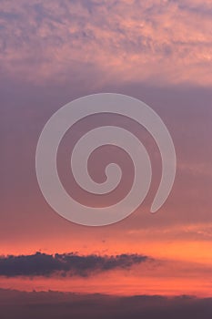 Glowing clouds on the red sky in evening light