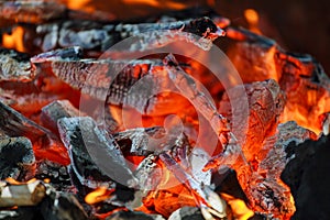 Glowing coals in a barbeque coal fire smoke