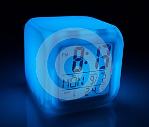 Glowing digital alarm clock with date and temperature