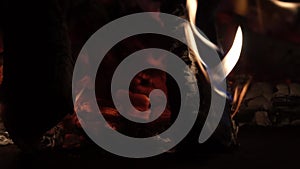 Glowing embers of bright red color, abstract background. Hot coals of a burning wood fire. Firewood