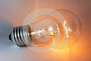 Glowing flashing light bulb lamp laying
