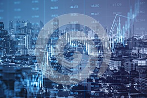 Glowing forex index chart/graph on toned  city backdrop. Trade, finance and market concept Double exposure