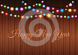 Glowing garland on wood background