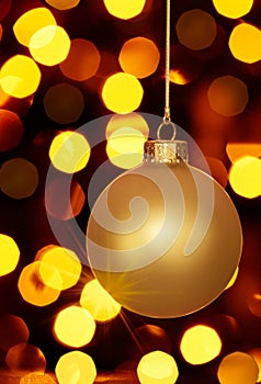 Glowing Gold Christmas Ornament And Holiday Lights