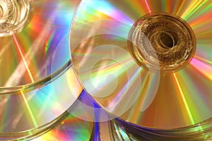 Glowing golden rainbow compact disks photo