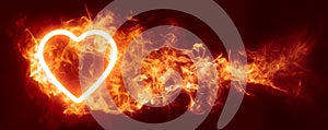 Glowing heart in an inferno of red hot flames wallpaper or Valentine\'s background. Symbolizing passion, lust, or desire