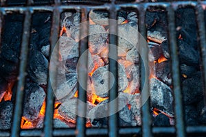 Glowing hot charcoal briquettes