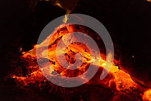 Glowing Hot Coals In A Smouldering Camp Fire Pit