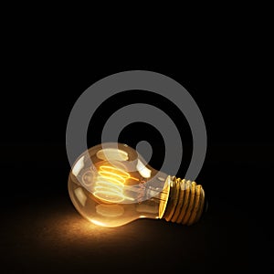 Glowing Incandescent Light Bulb on a Dark Background