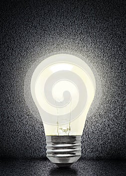 Glowing Incandescent Light Bulb Isolated on Asphalt Background