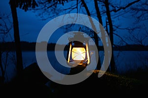 Glowing lantern against dark night time