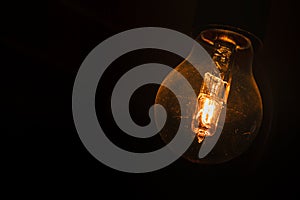 Glowing light bulb in the dark