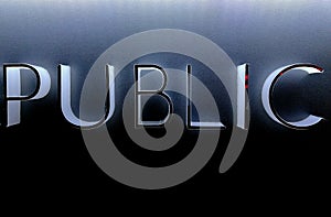 Glowing light Public text on black wall