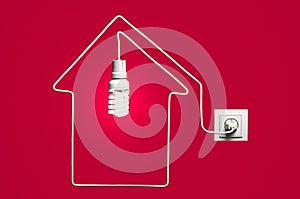 Glowing lightbulb in a house