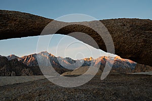 Glowing Lone Pine Peak and Mount Whitney Under Lathe Arch During Sunrise, Alabama Hills, Lone Pine, California