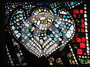 A glowing look at a white dove on a stained glass window in the center of GdaÅ„sk- Poland