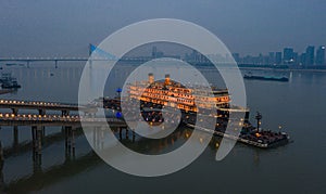 Glowing majestic Wuhan Zhiyin cruise ship by the Yangtze River, China
