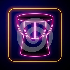 Glowing neon African darbuka drum icon isolated on black background. Musical instrument. Vector