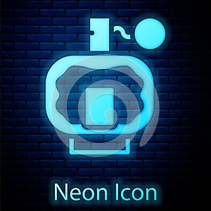 Glowing neon Aftershave icon isolated on brick wall background. Cologne spray icon. Male perfume bottle. Vector