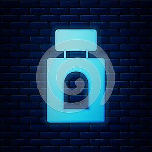 Glowing neon Aftershave icon isolated on brick wall background. Cologne spray icon. Male perfume bottle. Vector