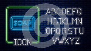 Glowing neon Bar of soap icon isolated on brick wall background. Soap bar with bubbles. Neon light alphabet. Vector