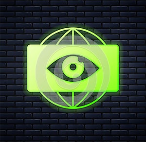 Glowing neon Big brother electronic eye icon isolated on brick wall background. Global surveillance technology, computer