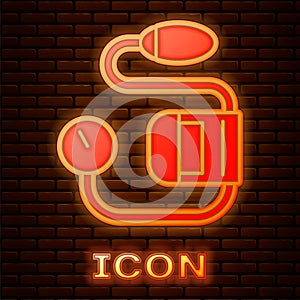 Glowing neon Blood pressure icon isolated on brick wall background. Vector Illustration