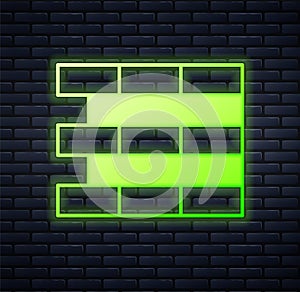 Glowing neon Bricks icon isolated on brick wall background. Vector