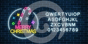 Glowing neon christmas sign with christmas candy cane and alphabet. Christmas symbol web banner in neon style.