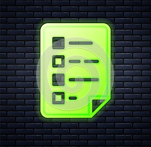 Glowing neon Clipboard with checklist icon isolated on brick wall background. Control list symbol. Survey poll or