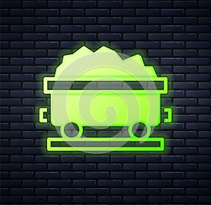 Glowing neon Coal train wagon icon isolated on brick wall background. Rail transportation. Vector