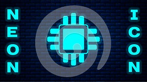 Glowing neon Computer processor with microcircuits CPU icon isolated on brick wall background. Chip or cpu with circuit