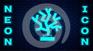 Glowing neon Coral icon isolated on brick wall background. Vector