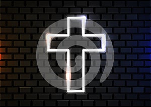 Glowing neon cross on brick wall background. Christian symbol.