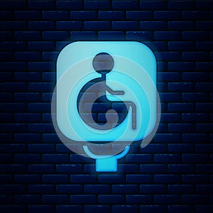 Glowing neon Disabled wheelchair icon isolated on brick wall background. Disabled handicap sign. Vector